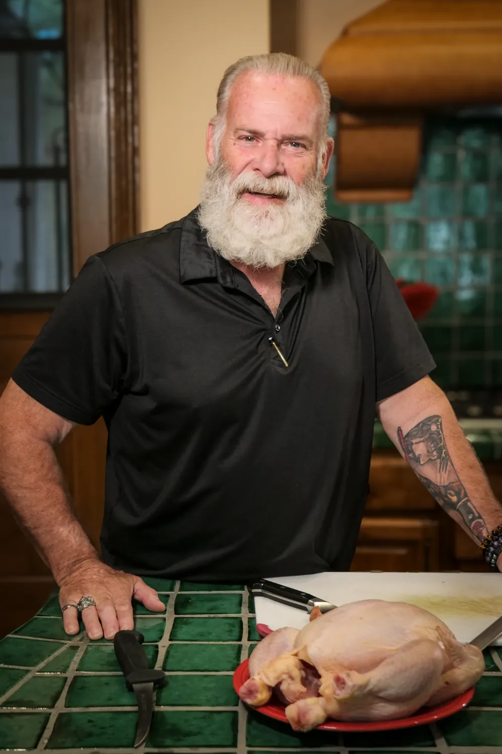 Chef Bryan Dillon, Master Certified Food Executive, working professionally in a modern green kitchen environment, demonstrating his expertise in luxury restaurant operations
